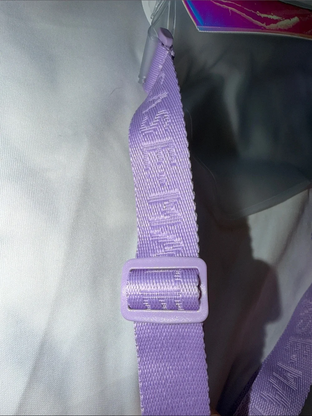 A BEAUTY-NEW case-mate Iridescent Waterproof Phone Belt Bag/Crossbody Strap.